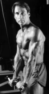 Frank Zane performing a cable triceps pushdown.