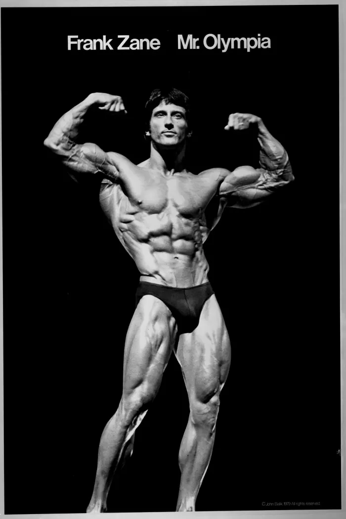 The iconic 1979 John Balik studio poster: sharp, high-contrast black-and-white front double-biceps with title treatment.