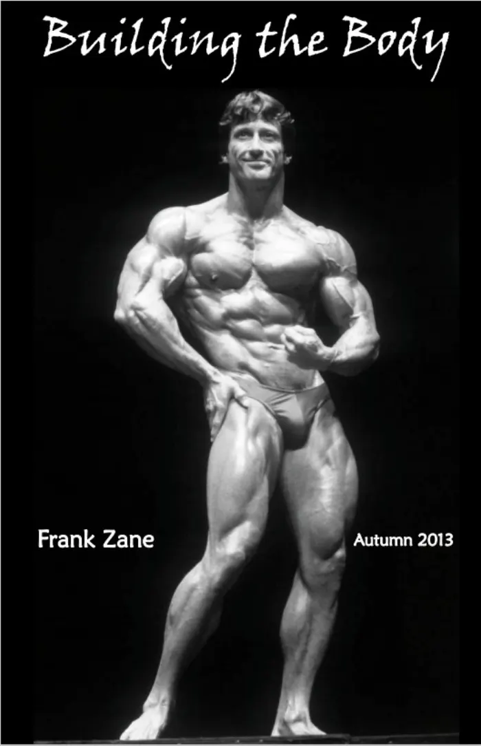 A dramatic studio-lit front double-biceps pose on pure black, framed by a desert-mountain title vignette.