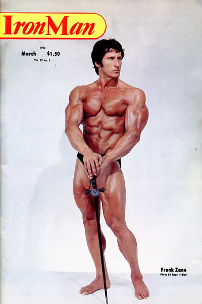 A stark, dramatically lit studio portrait holding a sword, credited to Rheo H Blair, gracing an IronMan cover.
